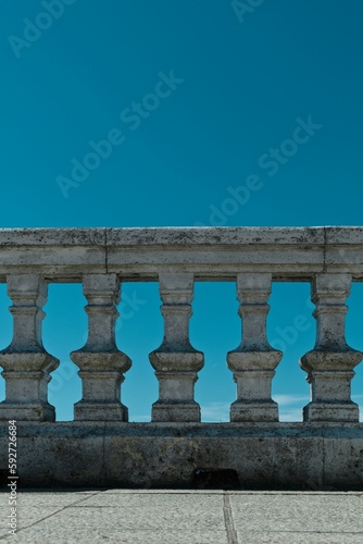 Stone railing against a blue sky
