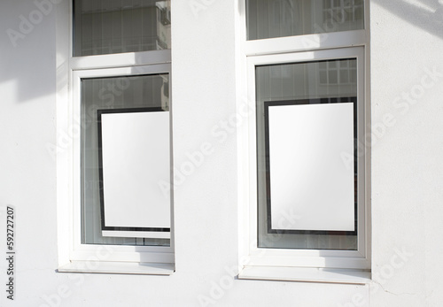 white rectangle logo on wall with windows  exterior for mockup design