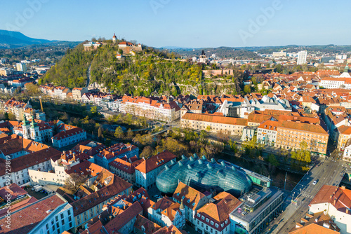 CIty of Graz in Austria on a sunny spring day with the landmark Schloßberg photo