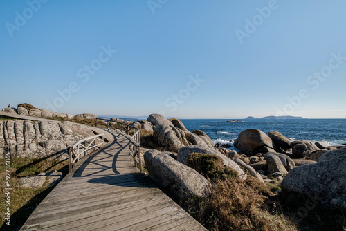 Zigzag wooden walkway in rocky coastline