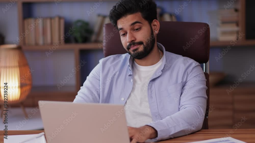 indian businessman work in office with documents and laptop, yawning and feeling bored indian businessman work in office with documents and laptop, yawning and feeling bored