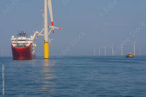 Fotografiet Support vessel and crew transfer vessel working on offshore wind farm