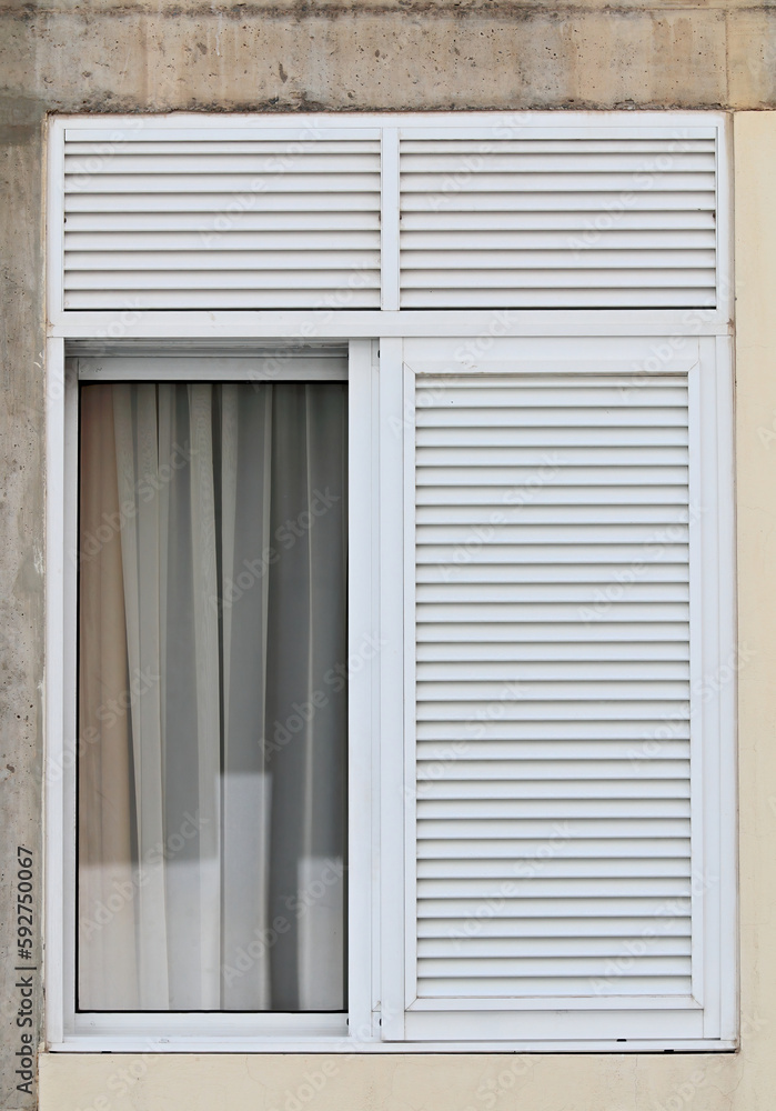 An open window with white curtains An open window with white curtains