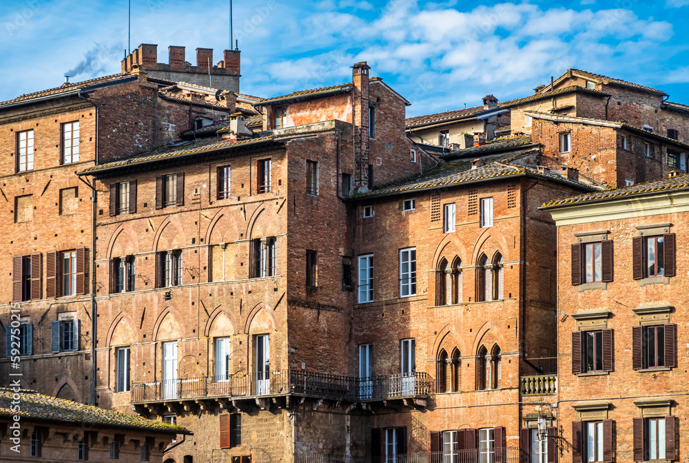 historic buildings at the old town of Siena in italy