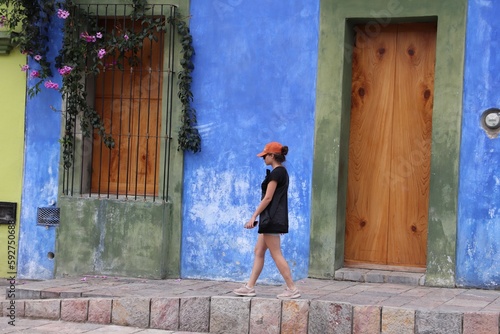 Girl walking in colorful city in Mexico © benjamin