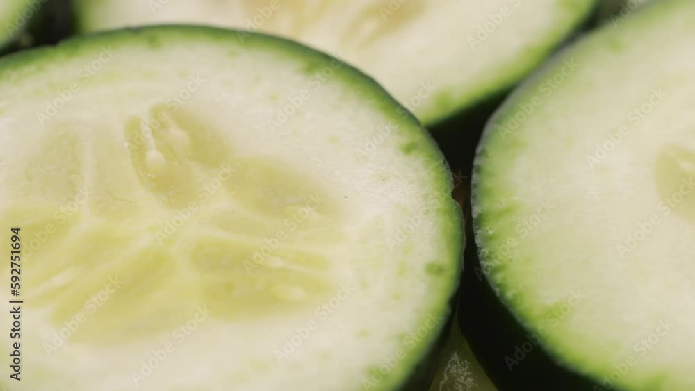 Slicing cucumber vegetables with a knife for cooking, chef cut vegetable. Slicing cucumber vegetables with a knife for cooking, chef cut vegetable.
