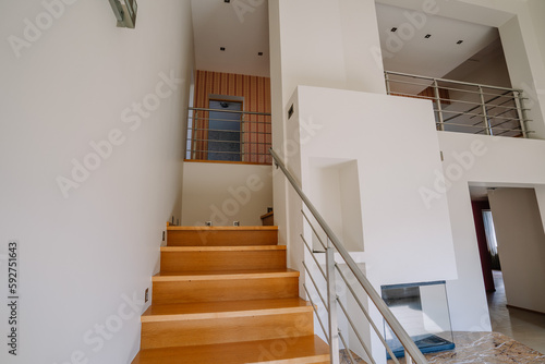 Brown stairs to the second floor in the house interior