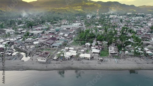 Aerial view of typhoon devastated shoreline SE Asia photo