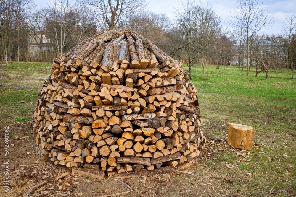 Firewood stacked for storage. Dry chopped firewood. firewood stack