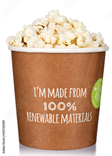 Paper cup with a popcorn on white.