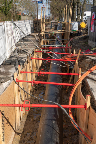 district heating pipes buried in a street, a construction site in Denmark