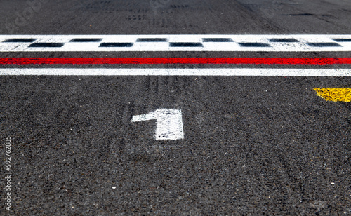 Photos Pole position number one sign on asphalt race track, arrival first win start con