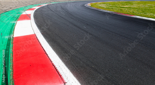 Motor sport asphalt race track and curbs turn close up