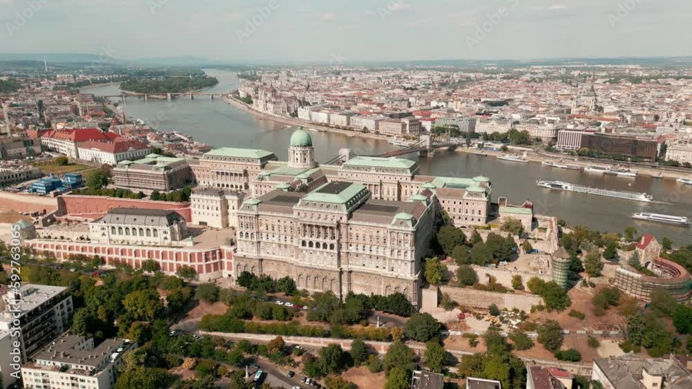 Aerial skyline view of Budapest and River Danube, Hungary. Aerial video from a drone shows the historical Buda Castle near the Danube. Hill in Budapest, Hungary. Aerial skyline view of Budapest and River Danube, Hungary. Aerial video from a drone shows the historical Buda Castle near the Danube. Hill in Budapest, Hungary.