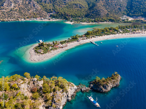 Aerial drone photo of Ölüdeniz, Fethiye, Turkey, showcasing the turquoise waters, picturesque coastline, and beautiful beaches of this popular summer destination. © gokcen