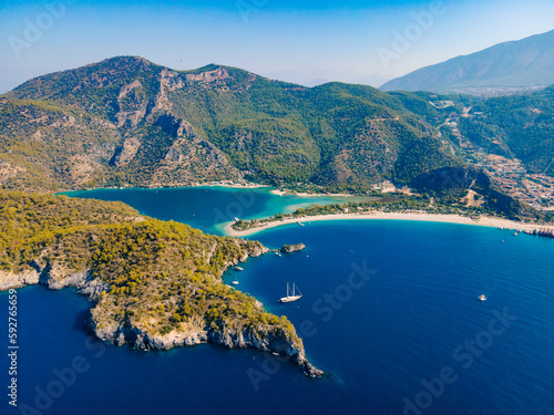 Aerial drone photo of Ölüdeniz, Fethiye, Turkey, showcasing the turquoise waters, picturesque coastline, and beautiful beaches of this popular summer destination. photo