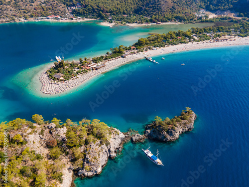 Fototapeta Naklejka Na Ścianę i Meble -  Aerial drone photo of Ölüdeniz, Fethiye, Turkey, showcasing the turquoise waters, picturesque coastline, and beautiful beaches of this popular summer destination.