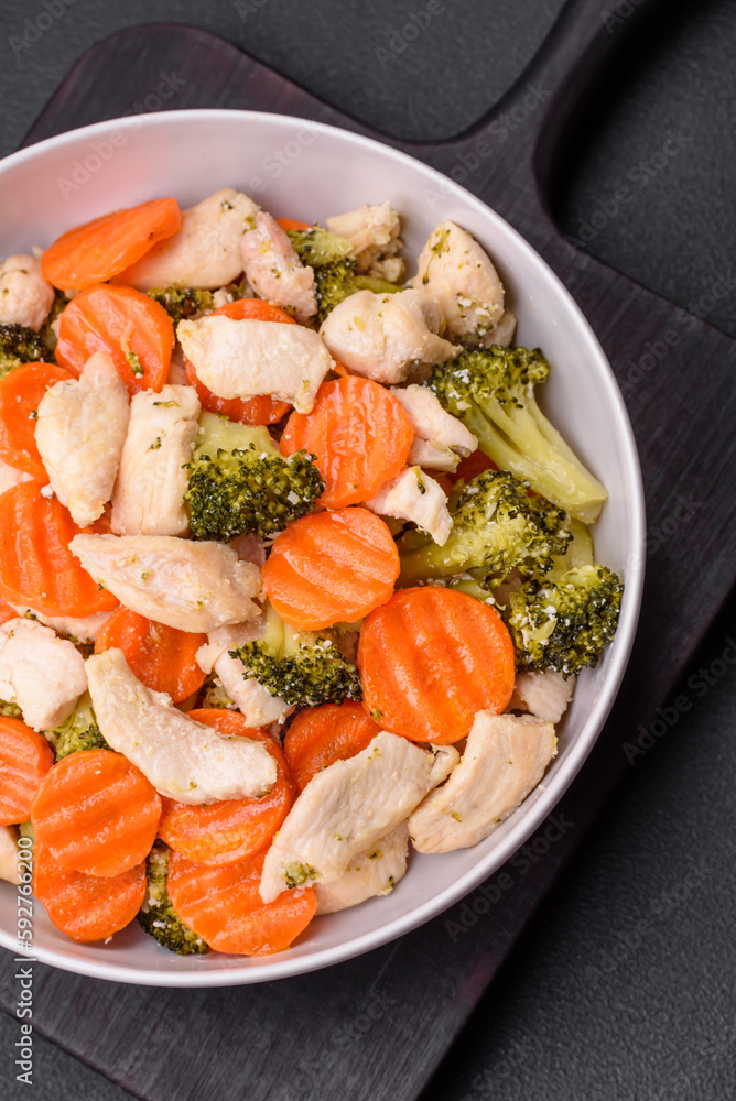 Delicious dish consisting of pieces of boiled chicken, broccoli and carrots Delicious dish consisting of pieces of boiled chicken, broccoli and carrots