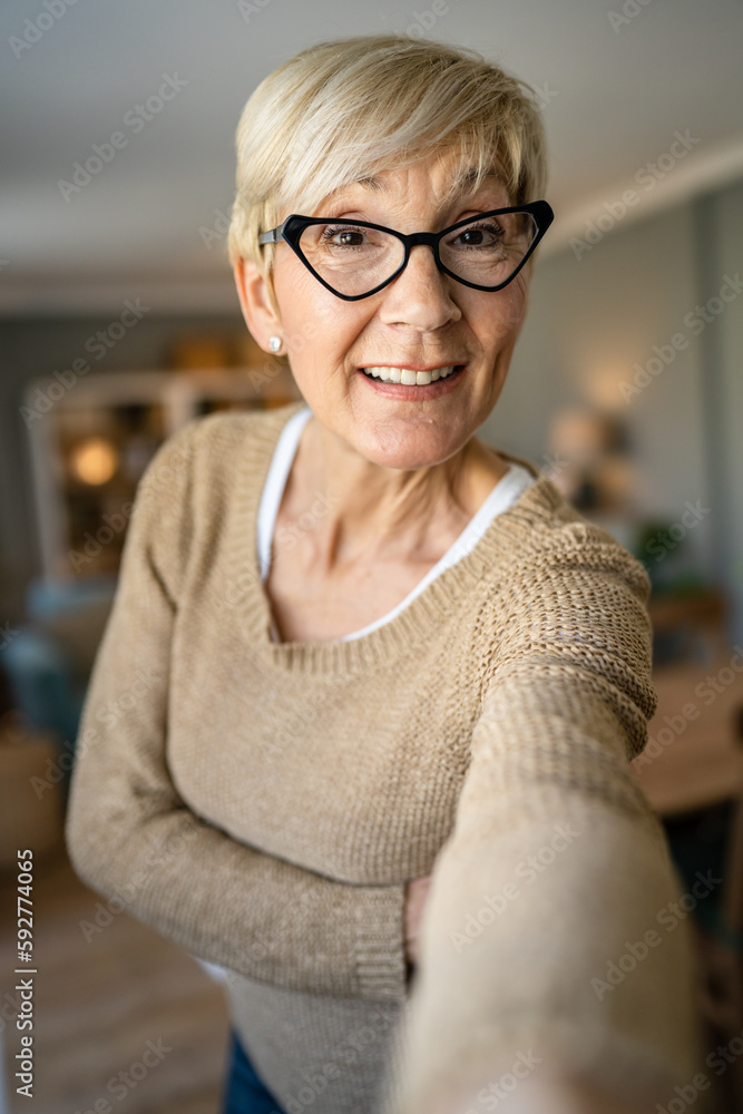 Close up portrait of one senior woman with short hair happy smile Close up portrait of one senior woman with short hair happy smile
