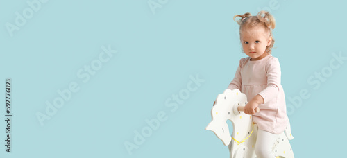 Adorable baby girl with roc...