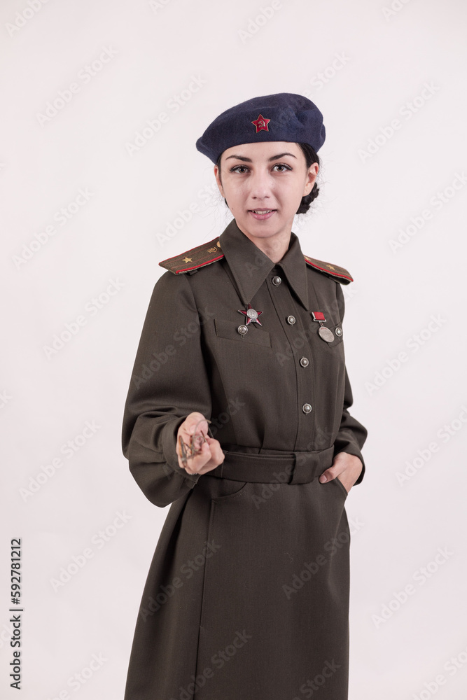 A woman in a retro military uniform, a military police of the Soviet army during World War Two A woman in a retro military uniform, a military police of the Soviet army during World War Two