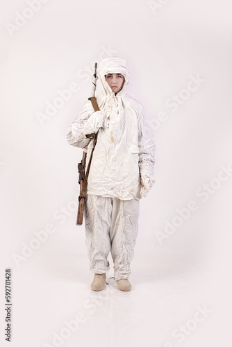 A woman in a winter military uniform white camouflage, a soldier of the Soviet army during World War Two
