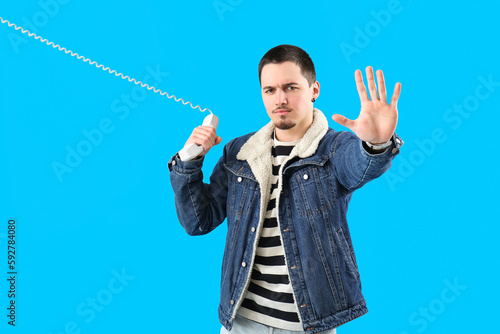 Displeased young man with p...
