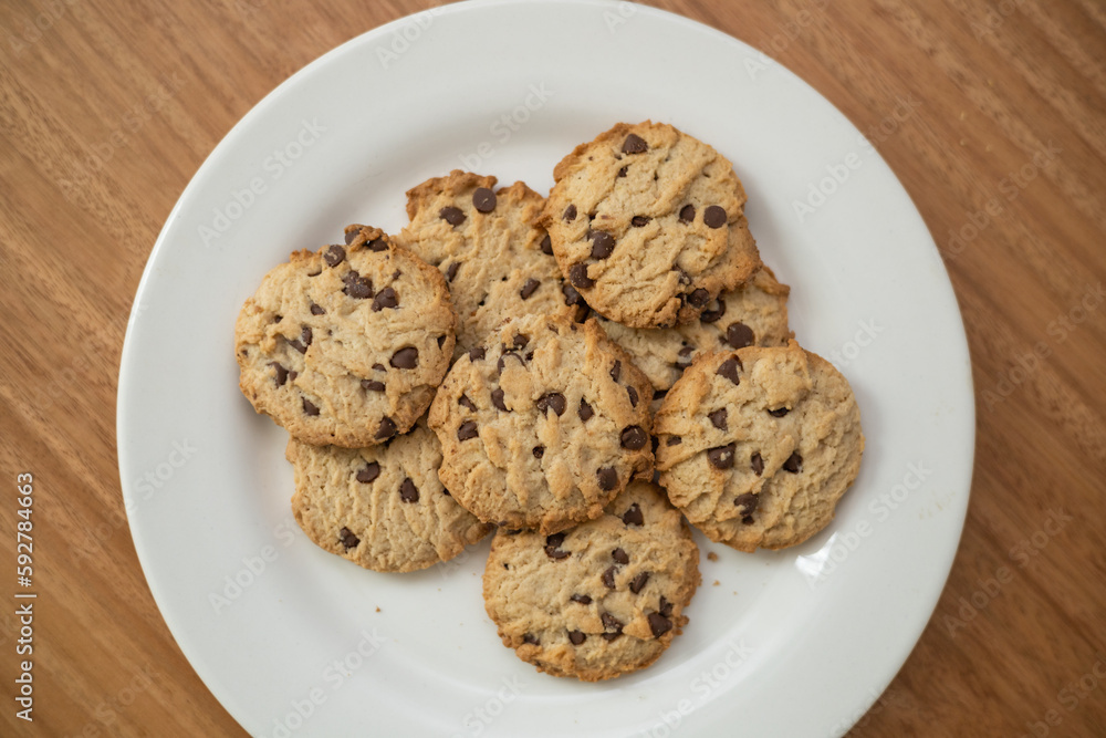 details of delicious cookies decorated with chocolate chips, pastry in studio, food and dessert texture details of delicious cookies decorated with chocolate chips, pastry in studio, food and dessert texture