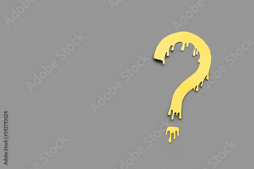Paper question mark on dark...
