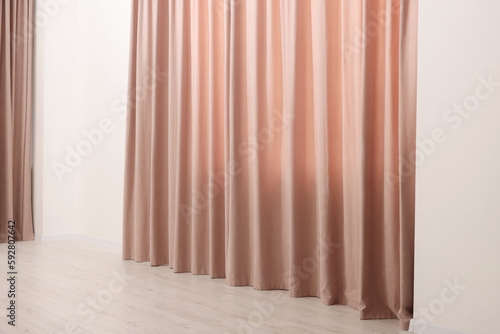 Elegant window curtains in room. Interior design