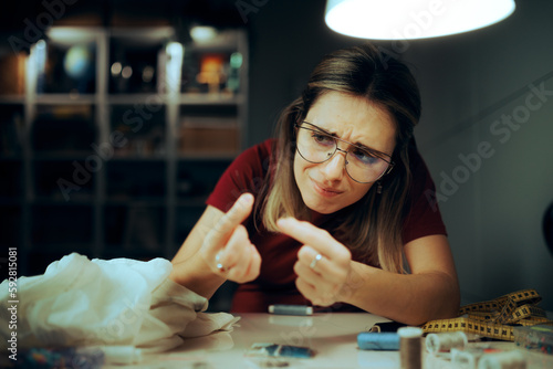 Glasses Wearer Trying to Thread a Needle. Woman failing to do simple tasks due to presbyopia eyesight condition
 photo