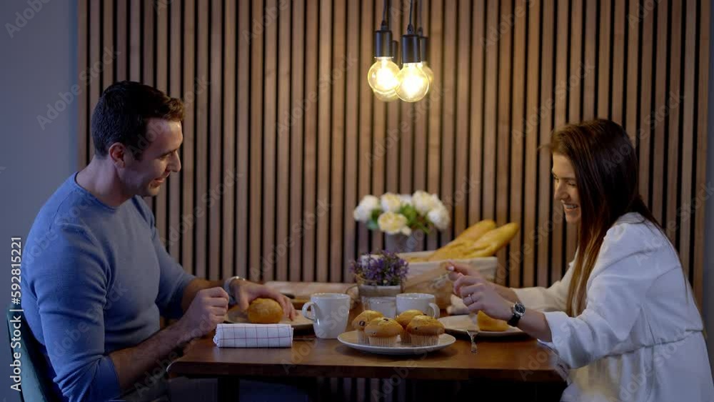 Young couple sitting togeher at the breakfast table - stock photography Young couple sitting togeher at the breakfast table - stock photography
