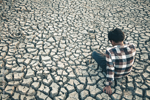 Landscape ground cracks drought crisis environment background.