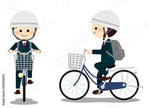 自転車通学用ヘルメットを被って自転車に乗る男子学生