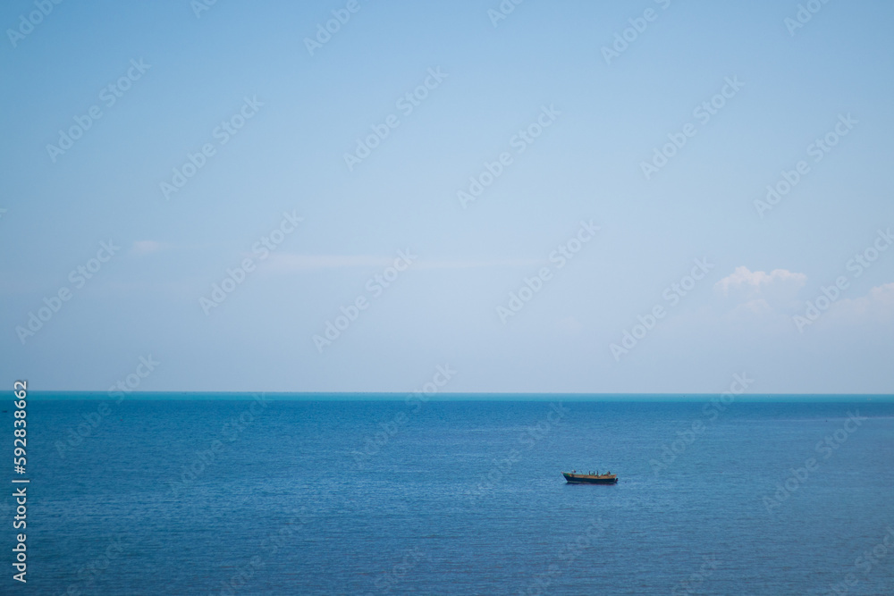 One Small boat in the blue sea