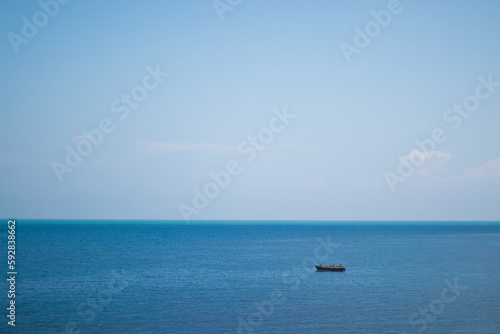 One Small boat in the blue sea © Harshith