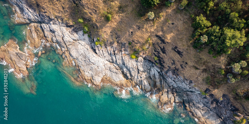 top view of ocean and rock texture. Aerial view of sea and fantastic Rocky coast.