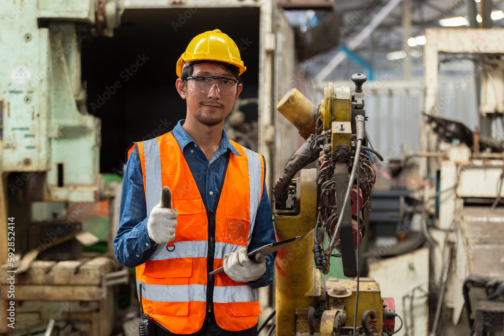 asian engineering worker man wearing uniform safety and hardhat working machine lathe metal in factory industrial, worker manufactory industry concept. repair serviceman at workshop. asian engineering worker man wearing uniform safety and hardhat working machine lathe metal in factory industrial, worker manufactory industry concept. repair serviceman at workshop.