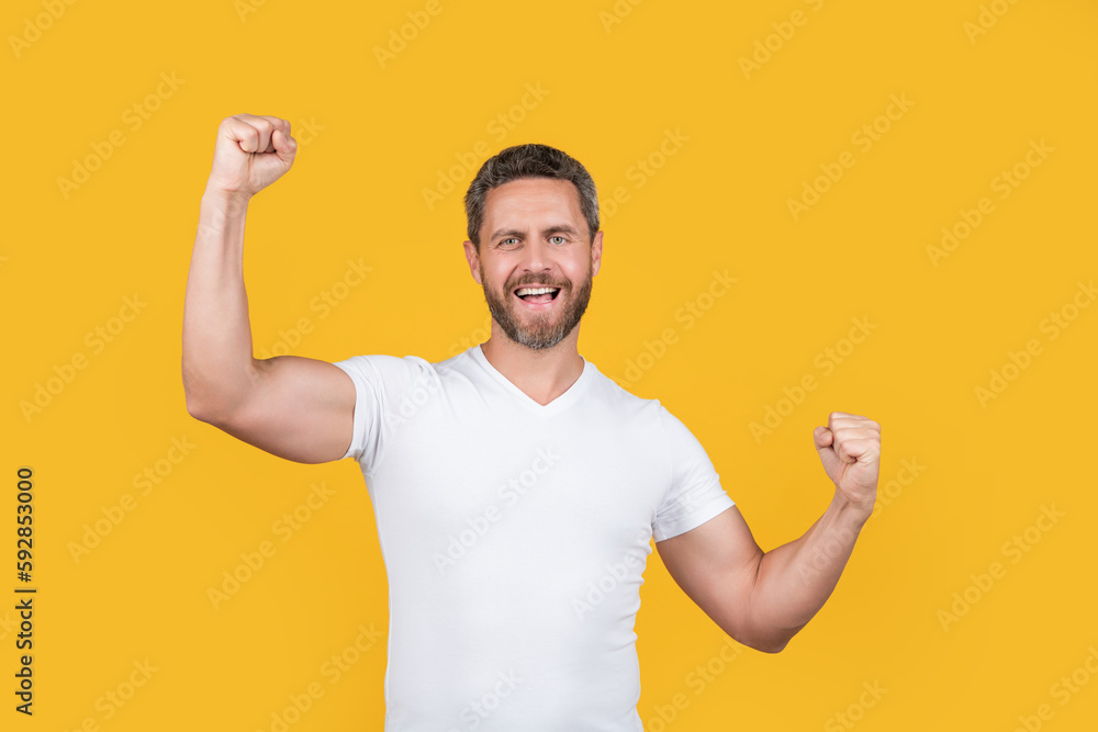 glad man wearing casual style. bearded man in casual shirt isolated on yellow background. glad man wearing casual style. bearded man in casual shirt isolated on yellow background.