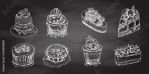 Desserts set  isolated on chalkboard  background. Vintage Illustration. Hand drawn sketch of Delicious Cupcakes and cakes With cream and berry tops, pancakes with berries and syrup, tartlets. Design 