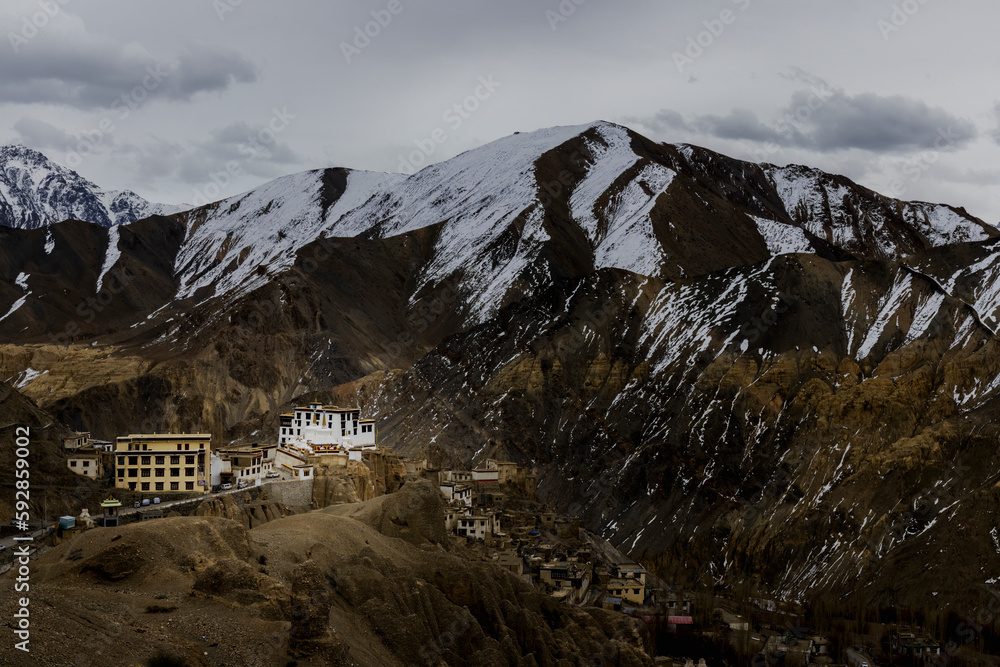 
Located in Ladakh, the stunning Lamayuru Monastery is set amidst snow-capped mountains, offering a truly breathtaking sight that is both beautiful and awe-inspiring from a distance.