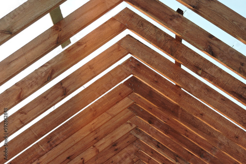 A timber roof truss of a house under construction