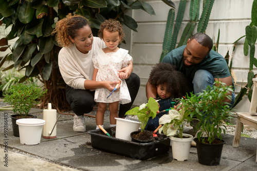 Wallpaper Mural Happy African American family enjoying gardening at home Torontodigital.ca