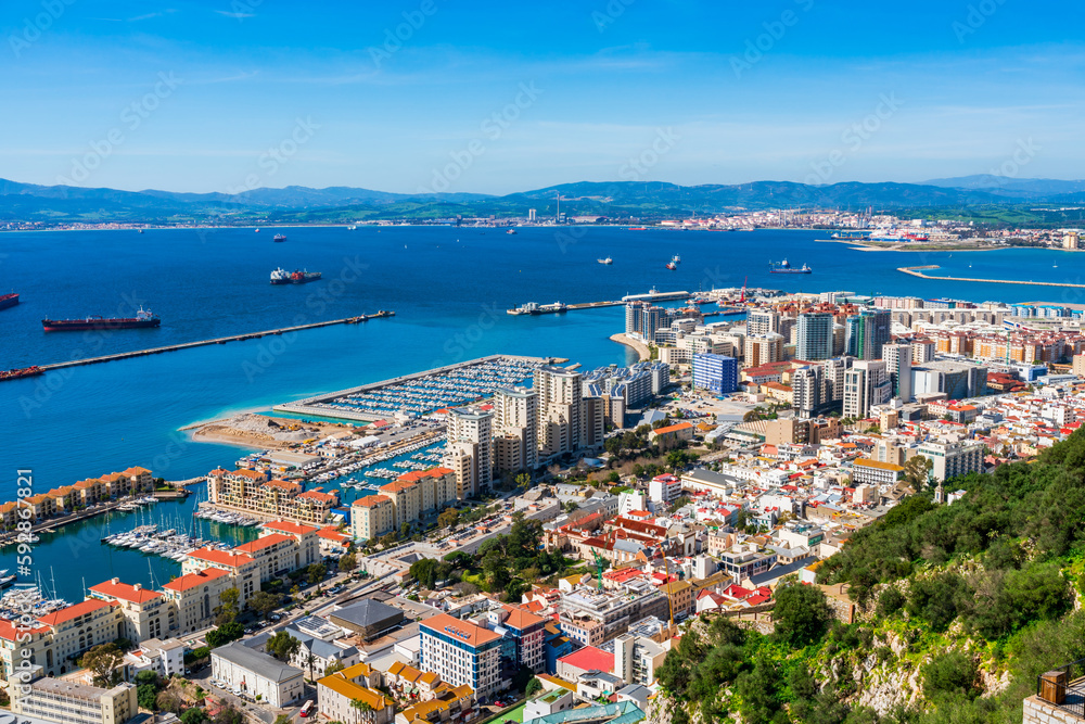 View of Gibraltar town - a British Overseas Territory, and Spain across Bay of Gibraltar from the Upper Rock. UK