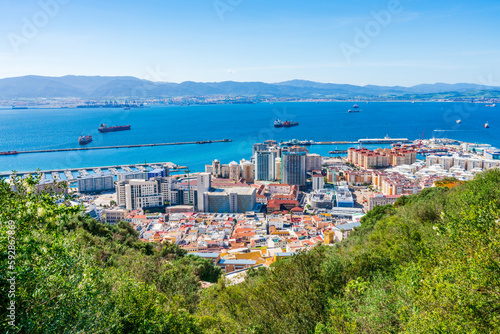 View of Gibraltar town - a British Overseas Territory, and Spain across Bay of Gibraltar from the Upper Rock. UK