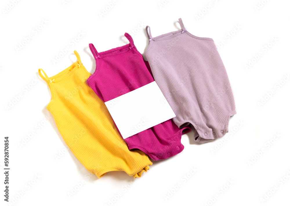 Seconhand, donate concept. Used kids clothes with empty paper blank. Selling baby clothes. Seconhand, donate concept. Used kids clothes with empty paper blank. Selling baby clothes.