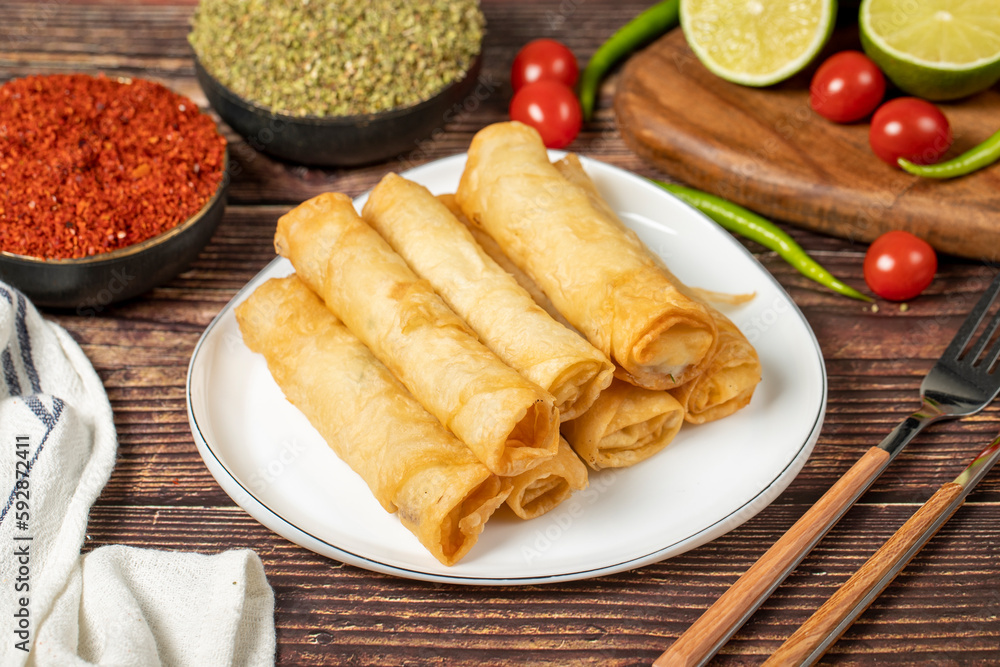 Cigarette pastry. Cheese pie on wood floor. Fried cheese rolls with phyllo. Local name sigara boregi Cigarette pastry. Cheese pie on wood floor. Fried cheese rolls with phyllo. Local name sigara boregi