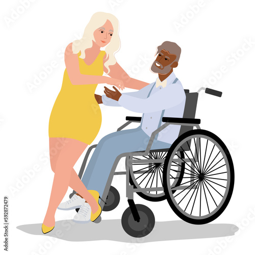 Young man in a wheelchair dancing with woman