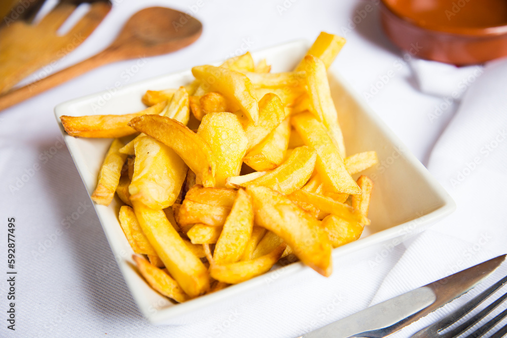 French Fries are potatoes that are made by cutting them into batons and frying them in hot oil until golden brown and crisp. French Fries are potatoes that are made by cutting them into batons and frying them in hot oil until golden brown and crisp.