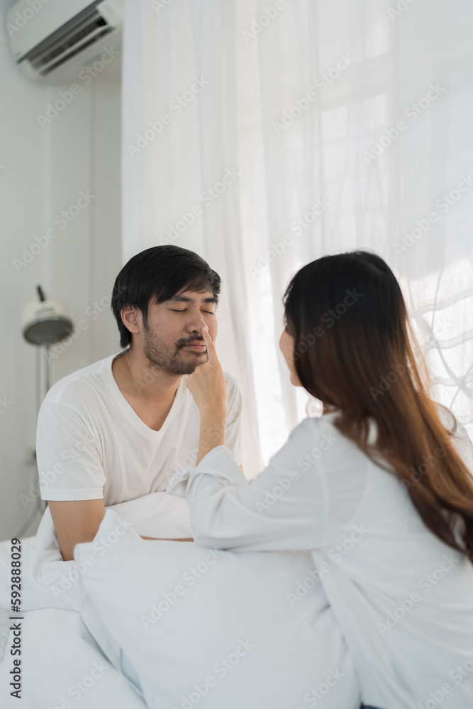Asian Romantic couple in bed enjoying sensual foreplay Happy sensual young couple lying in bed together. Beautiful loving couple kissing in bed. Asian Romantic couple in bed enjoying sensual foreplay Happy sensual young couple lying in bed together. Beautiful loving couple kissing in bed.
